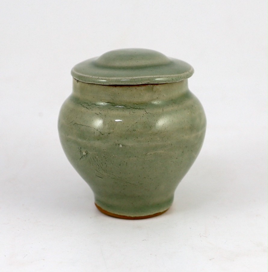 A Chinese celadon small baluster jar and cover, Southern Song dynasty or later, 8cm high